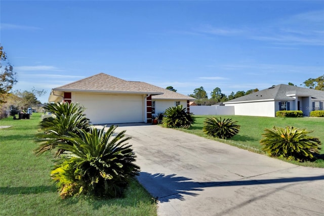 view of front facade with a front yard and a garage