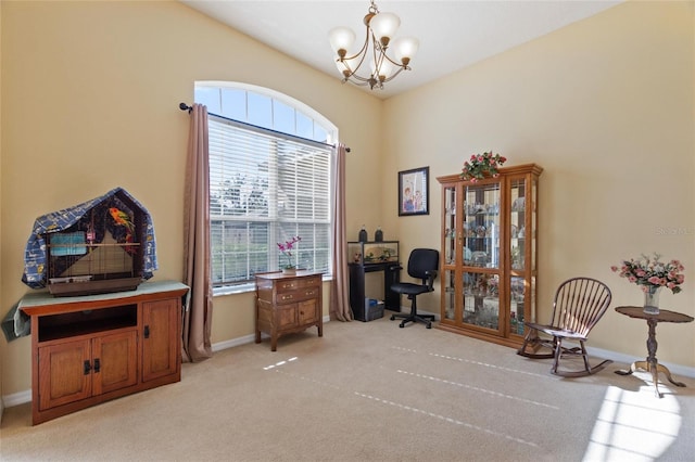 sitting room with light carpet and an inviting chandelier