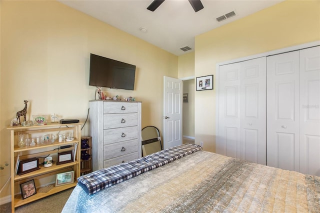 carpeted bedroom featuring a closet and ceiling fan