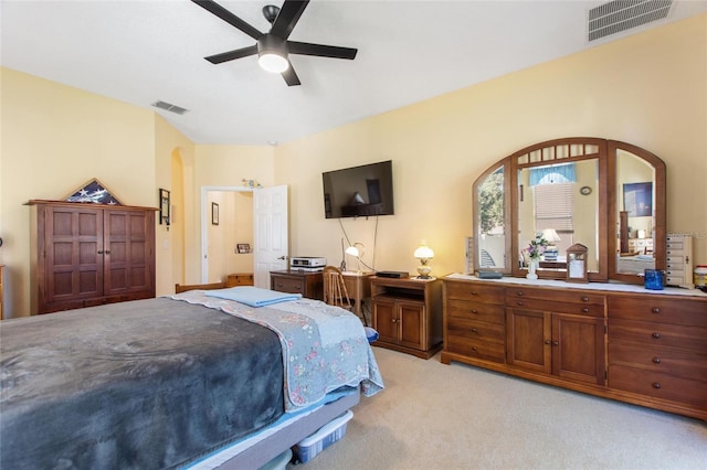 bedroom with ceiling fan and light carpet