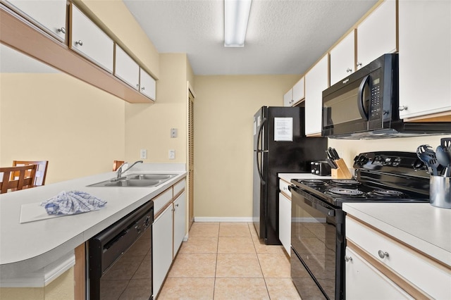 kitchen with white cabinetry, sink, a textured ceiling, light tile patterned floors, and black appliances