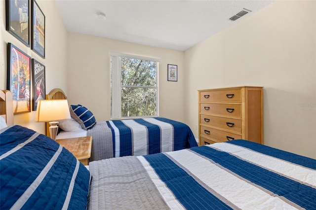 bedroom featuring visible vents