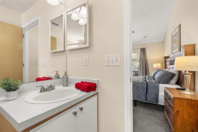 bathroom featuring vanity and a textured ceiling