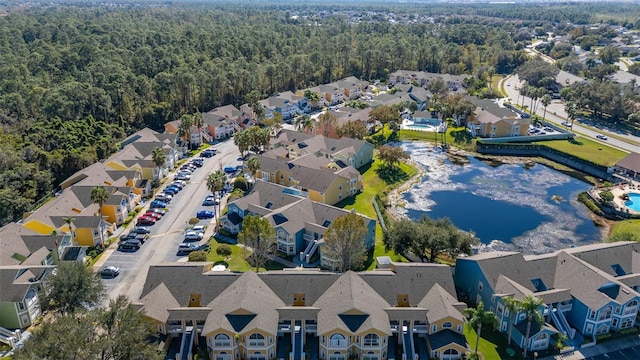 drone / aerial view with a forest view and a residential view