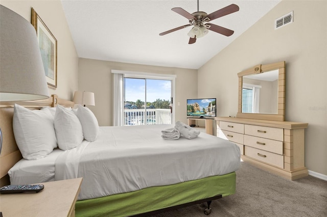 carpeted bedroom with access to outside, ceiling fan, and vaulted ceiling