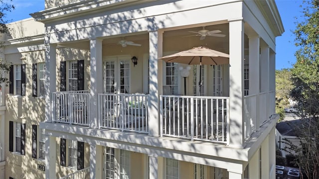 exterior space with a balcony and ceiling fan