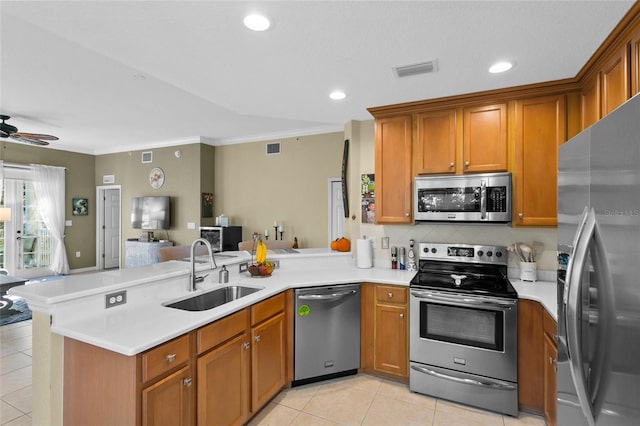 kitchen with ceiling fan, sink, kitchen peninsula, and stainless steel appliances