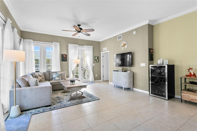 tiled living room with ceiling fan, crown molding, and wine cooler