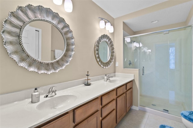 bathroom featuring vanity, tile patterned floors, and an enclosed shower