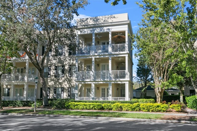 view of front of house with a balcony