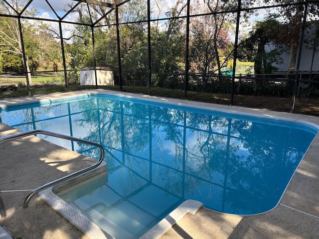 view of pool with a storage unit