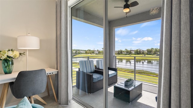 interior space featuring a water view and ceiling fan