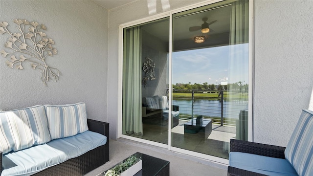 balcony featuring a water view and an outdoor hangout area