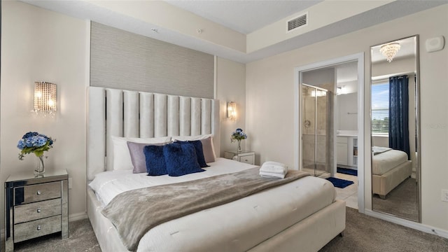 bedroom with carpet flooring and ensuite bathroom