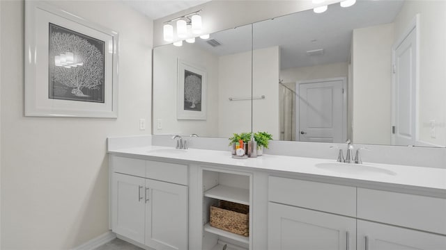 bathroom with a shower and vanity