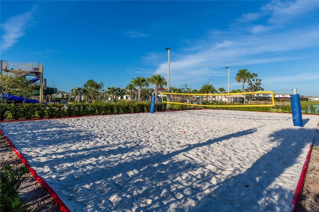 view of home's community featuring volleyball court