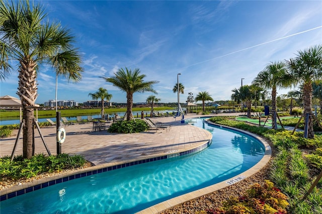 view of pool featuring a water view