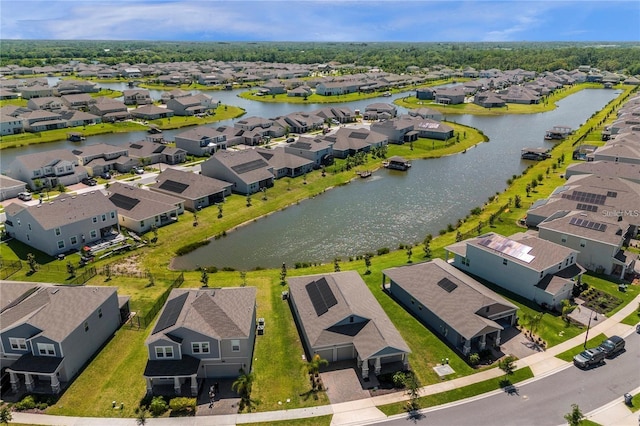 drone / aerial view with a water view