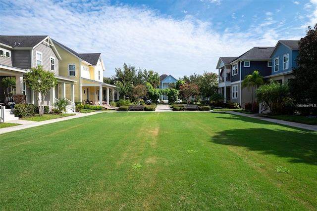 view of home's community featuring a yard