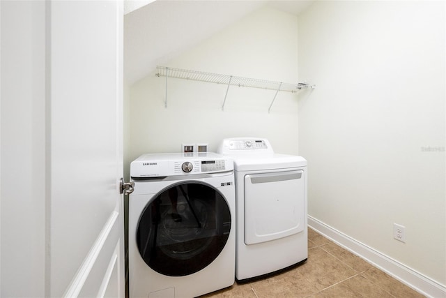 laundry room featuring light tile patterned flooring and independent washer and dryer