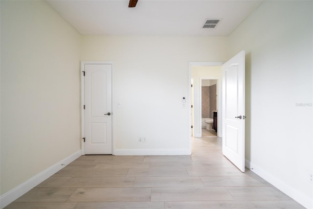 spare room featuring light wood-type flooring