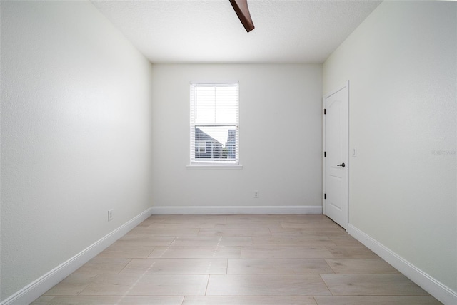 spare room featuring a textured ceiling