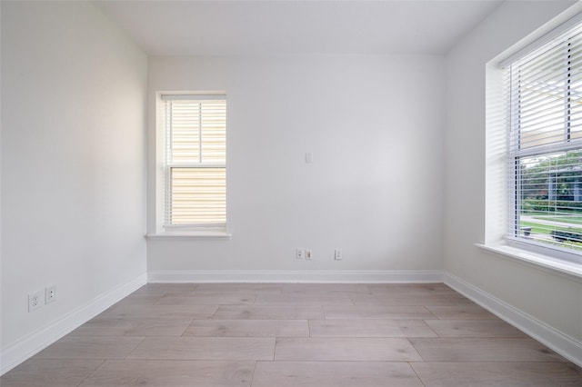 empty room with baseboards