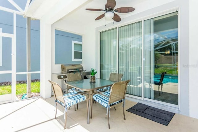 exterior space with ceiling fan and a patio