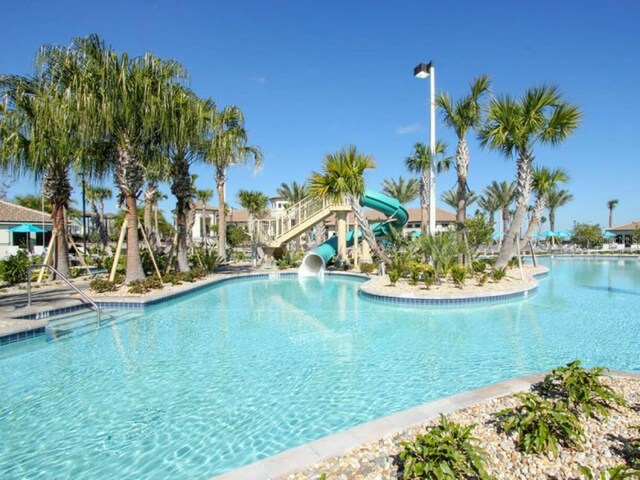 view of swimming pool featuring a water slide