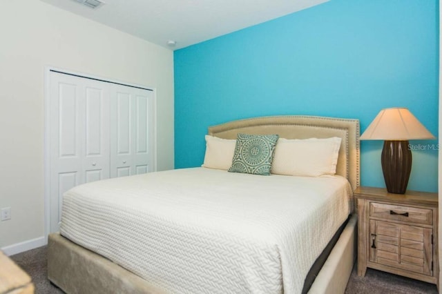 carpeted bedroom featuring a closet