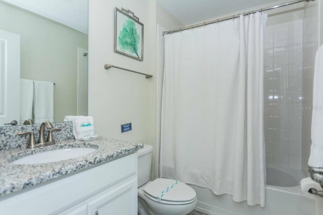 full bathroom with vanity, toilet, and shower / tub combo with curtain