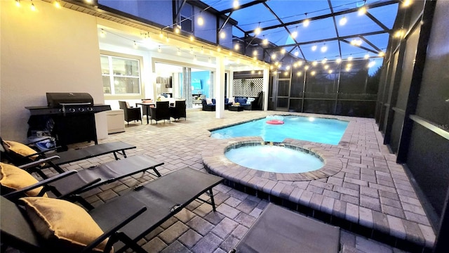 view of swimming pool featuring an in ground hot tub, a grill, outdoor lounge area, a patio, and a lanai