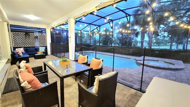 view of pool with a lanai, an outdoor hangout area, a patio area, and an in ground hot tub