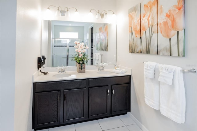 bathroom with vanity, tile patterned flooring, and a shower with door