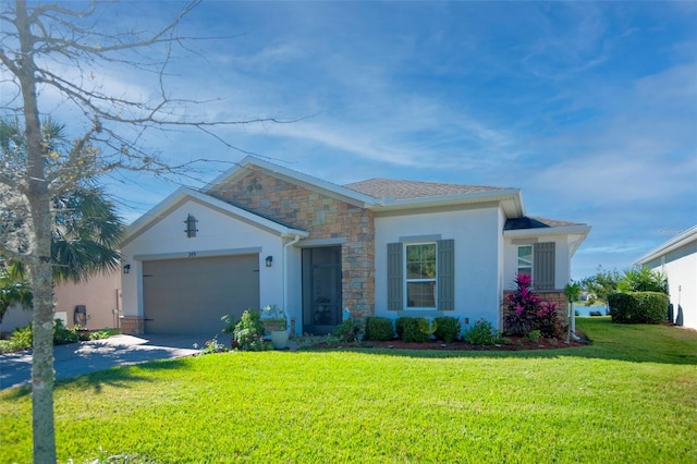 single story home featuring a front lawn and a garage