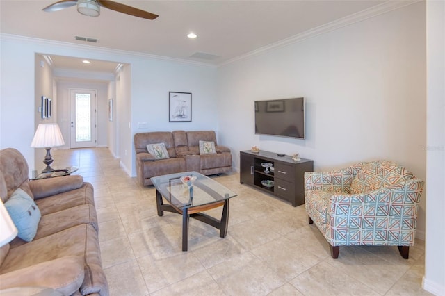 living room featuring ceiling fan, light tile patterned floors, and crown molding