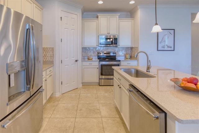 kitchen featuring light stone countertops, sink, tasteful backsplash, pendant lighting, and appliances with stainless steel finishes