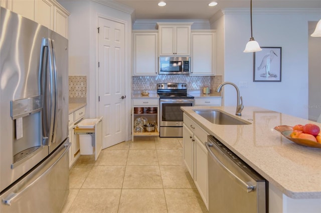 kitchen featuring sink, stainless steel appliances, light stone counters, crown molding, and pendant lighting