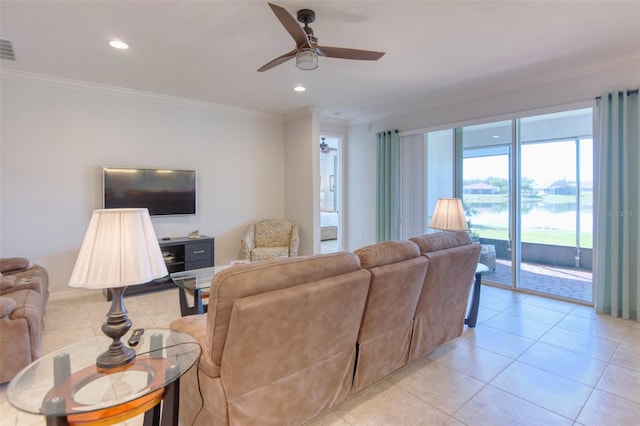 living room featuring ceiling fan, light tile patterned floors, and crown molding