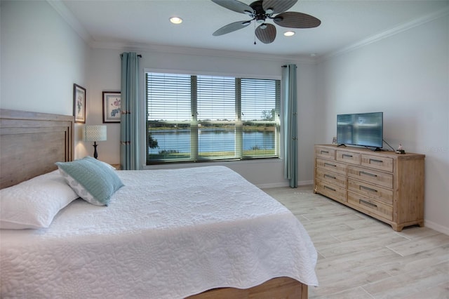 bedroom with ceiling fan, ornamental molding, and light hardwood / wood-style flooring