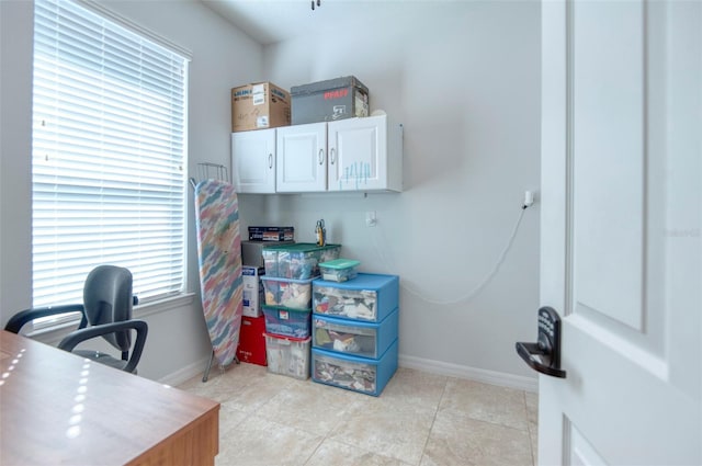 office area with light tile patterned flooring