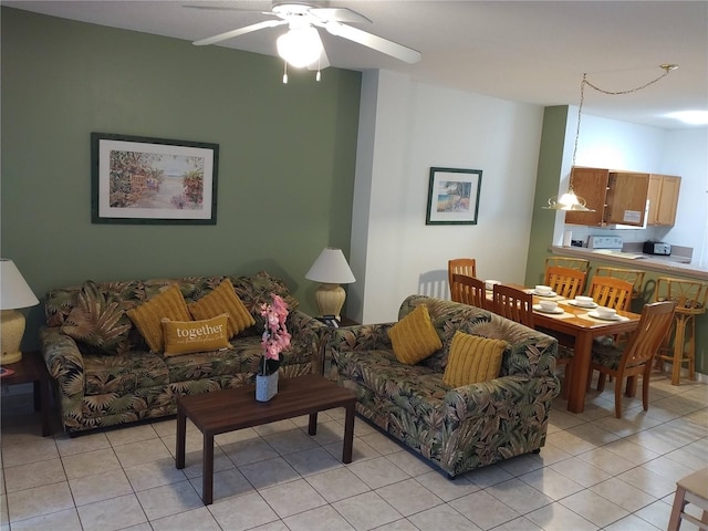 tiled living room with ceiling fan