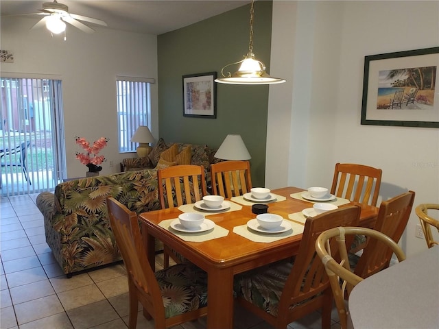 tiled dining space with ceiling fan