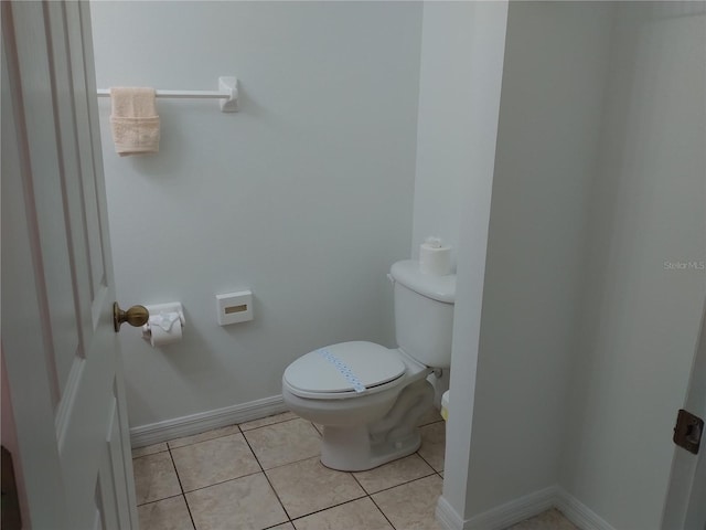 bathroom with tile patterned flooring and toilet