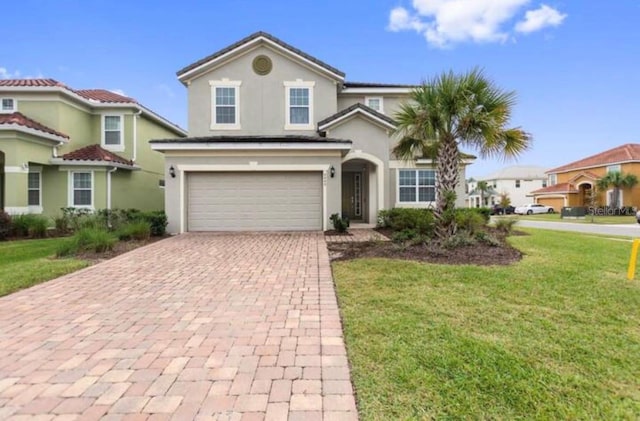 view of front facade with a front yard and a garage