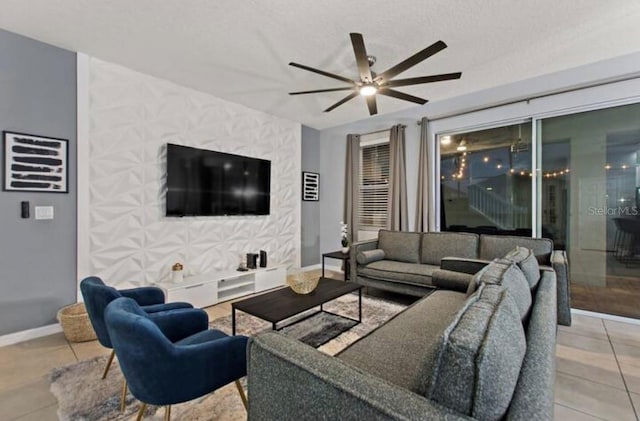 living room with ceiling fan and light tile patterned flooring