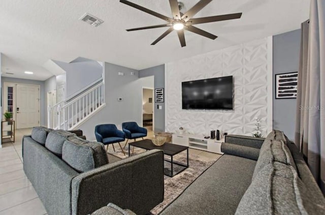 tiled living room with ceiling fan