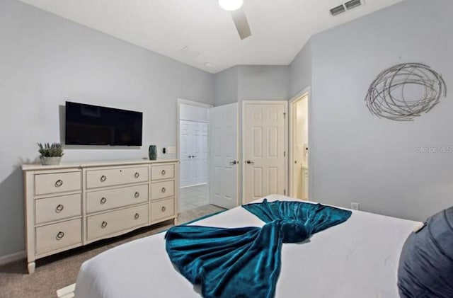 bedroom with light carpet and ceiling fan