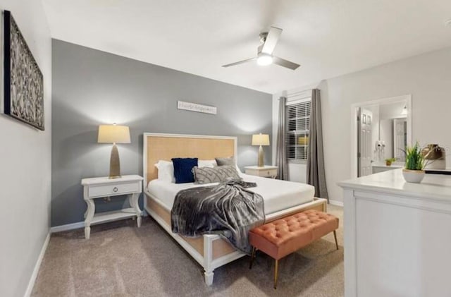 bedroom featuring ceiling fan, carpet floors, and connected bathroom