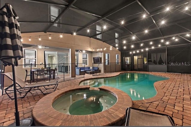 view of swimming pool with an in ground hot tub and a patio